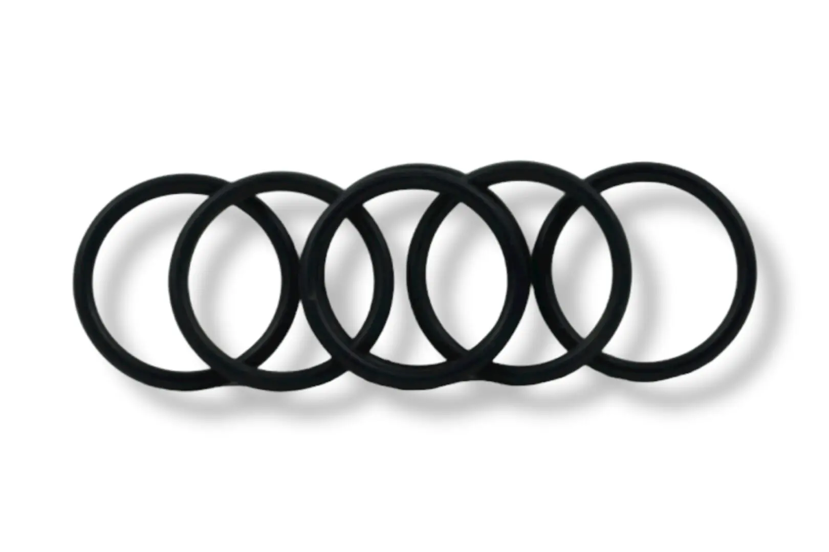 A group of six black rubber rings on top of each other.