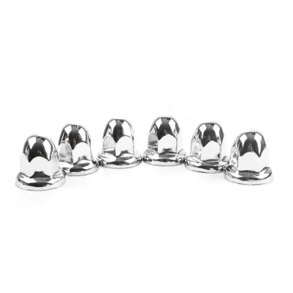 A group of chrome nuts sitting on top of each other.