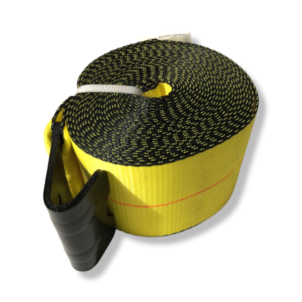 A yellow and black strap is laying on the ground.