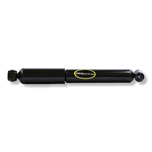 A black shock absorber is on the ground.