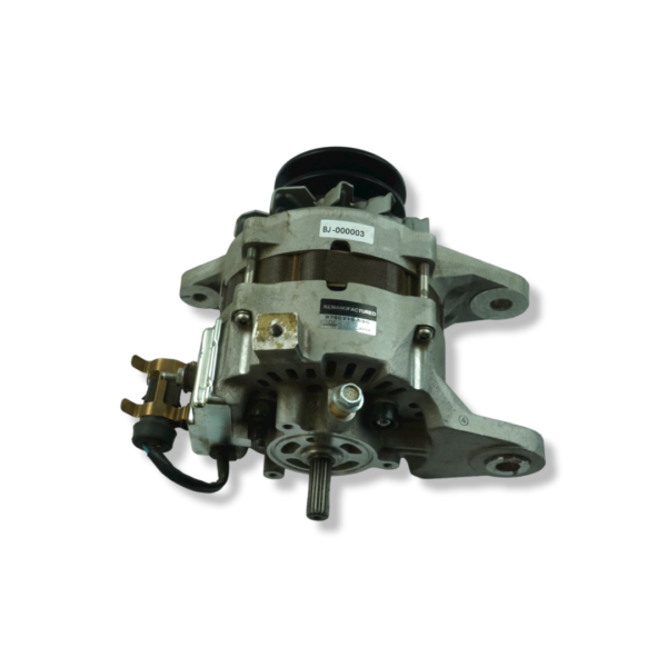 A silver and black motor is on top of the ground