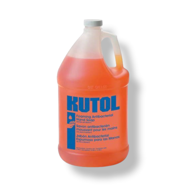 A gallon of orange liquid is sitting on the floor.