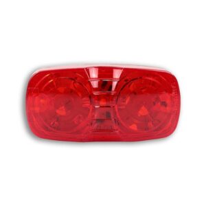 A red light that is on top of the ground.