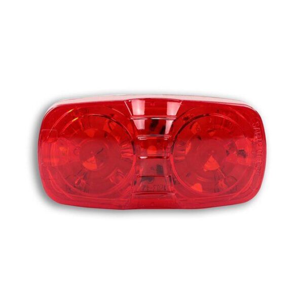A red light that is on top of the ground.