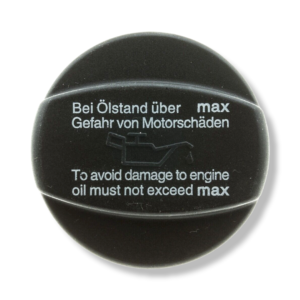 A black cap that says to avoid damage to engine oil must not exceed max.