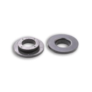 A pair of metal washers sitting next to each other.