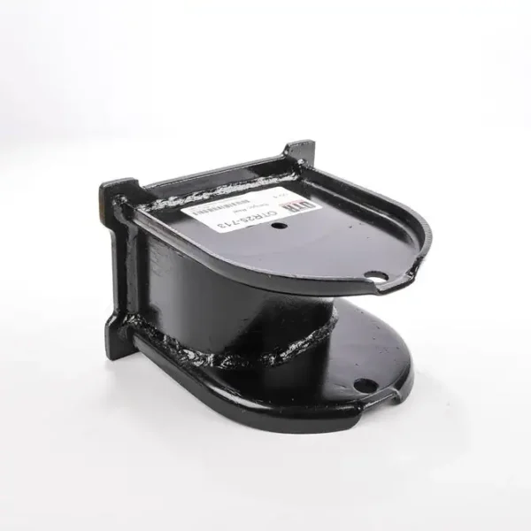 A black metal object sitting on top of a white table.