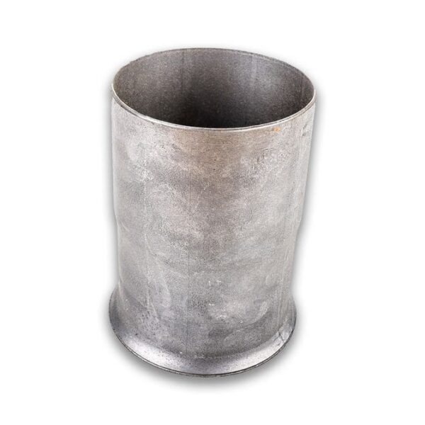 A metal cup sitting on top of a table.