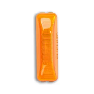 A close up of an orange light on a white background