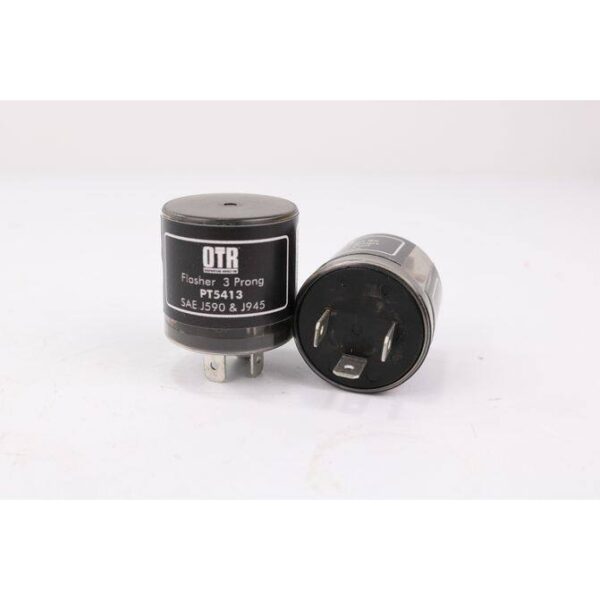 A pair of black and silver capacitors sitting next to each other.