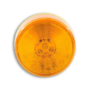 A yellow light that is on top of the floor.