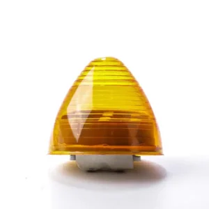 A yellow light is on and sitting on the floor.