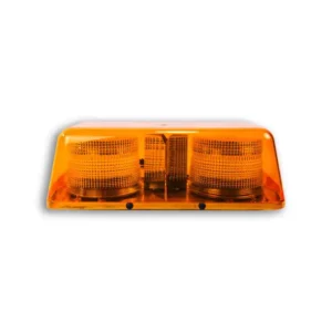 A yellow emergency light on top of a white wall.