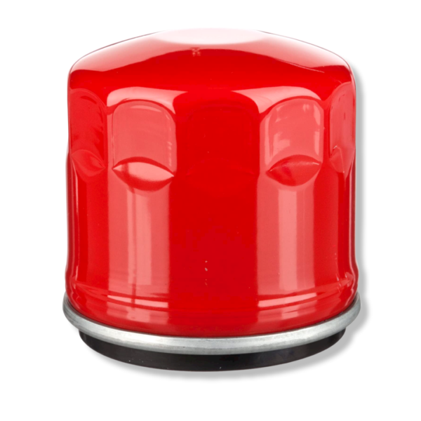 A red oil filter is sitting on top of the floor.